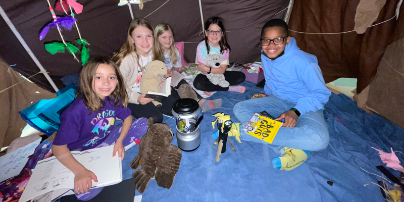 Students in wigwam