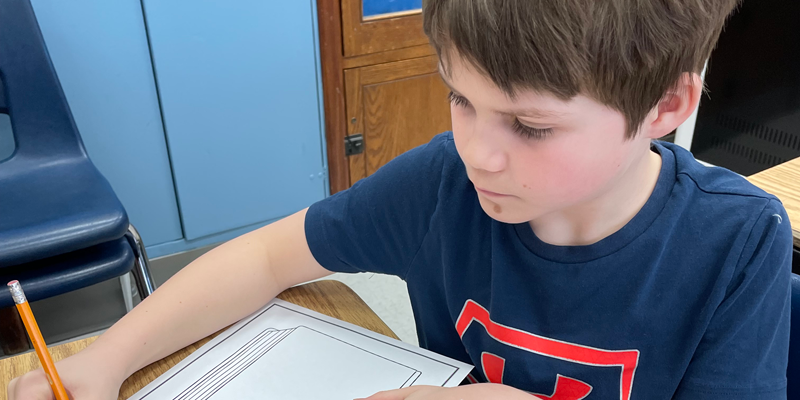 Student working on an  assignment in classroom